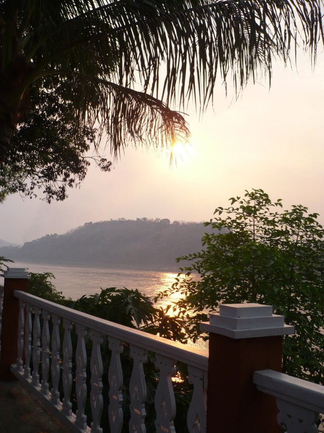 Sun sets over the Mekong in Luang Prabang.