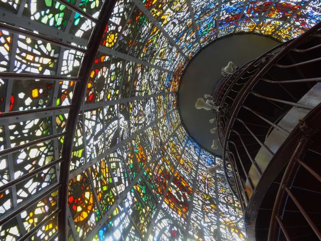Stain-glassed windows around the tower.