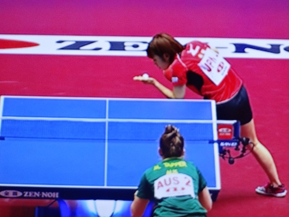 The Japanese player looks sternly at the ball, bending it to her will!