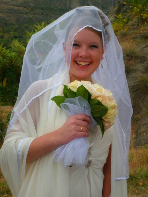 A bride in Tbilisi, Sioni Church, looking very happy on her big day.