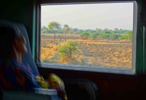 One of my favourite pics. Woman and scenery shortly after leaving Thazi.