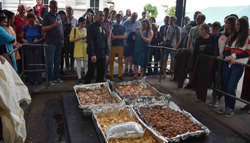 The food is on display above the underground 'oven'.
