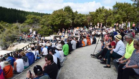 Crowds gather to see the geyser go.