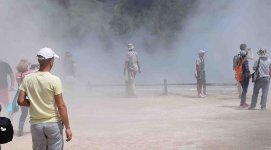 The steam rises off the hot water.