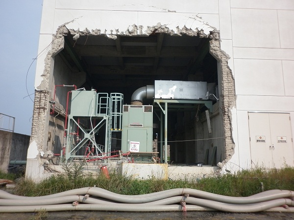 Damage to a factory still unrepaired (and factory not in operation) in Kesenumma, 2012.