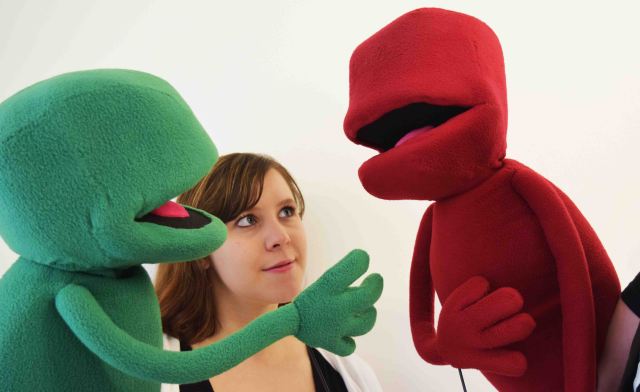 Green and Red Rita in conversation.