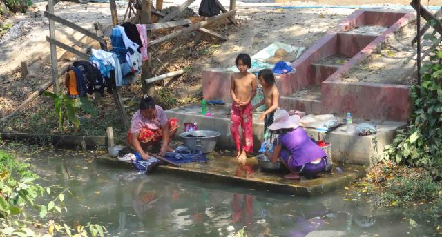 Kids play, Mum washes, Nyaungshwe.