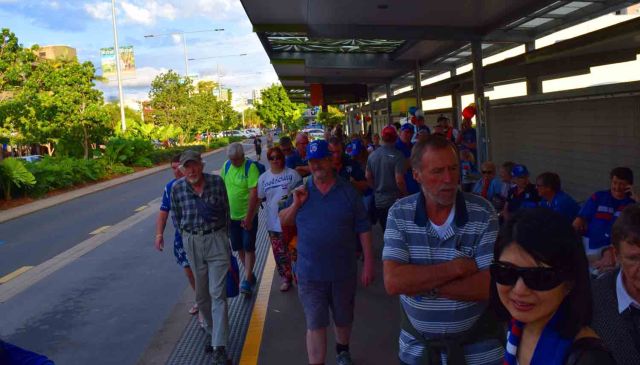 Waiting in Central Cairns at Bus Stop.