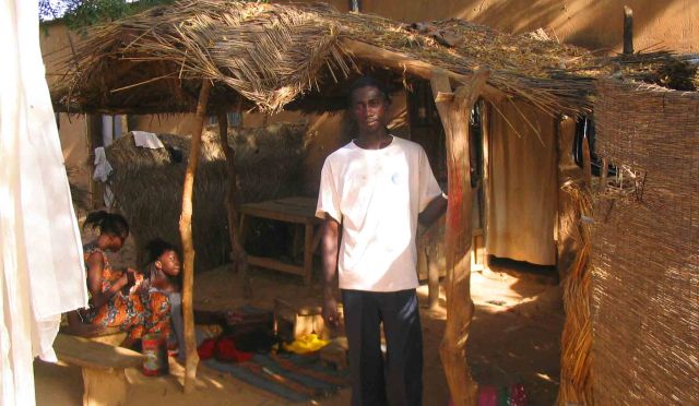 Halassi outside his home.