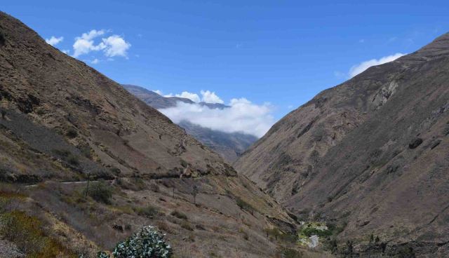 Track cut through the side of the mountain on the left.